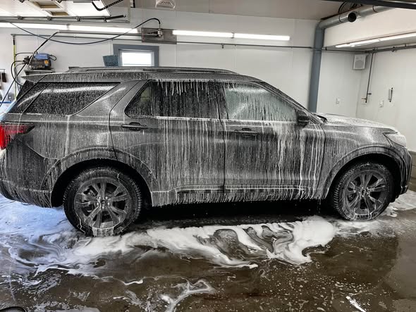 Ford Explorer being washed and prepped